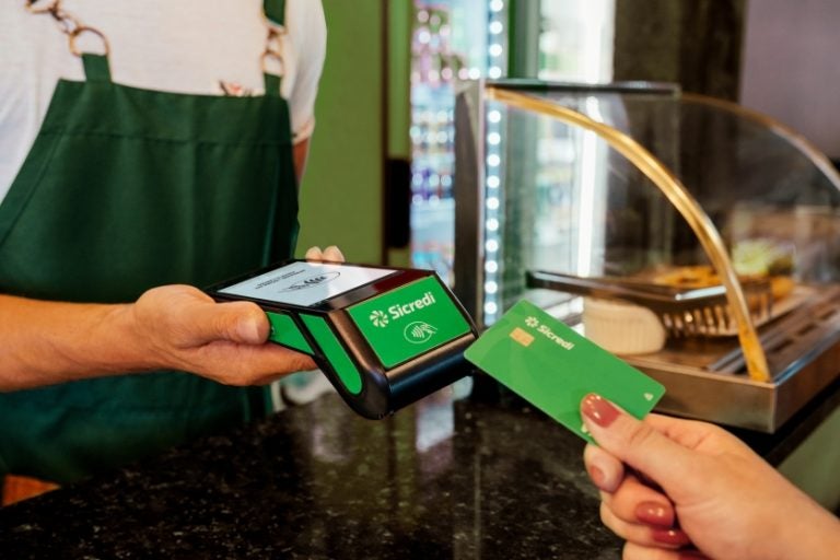 Manager Receiving The Payment, In A Cafeteria